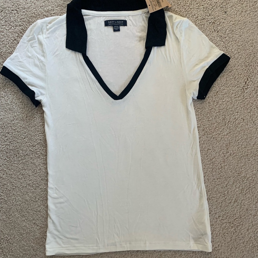 American Eagle stretchy top. White with black trim. NWT